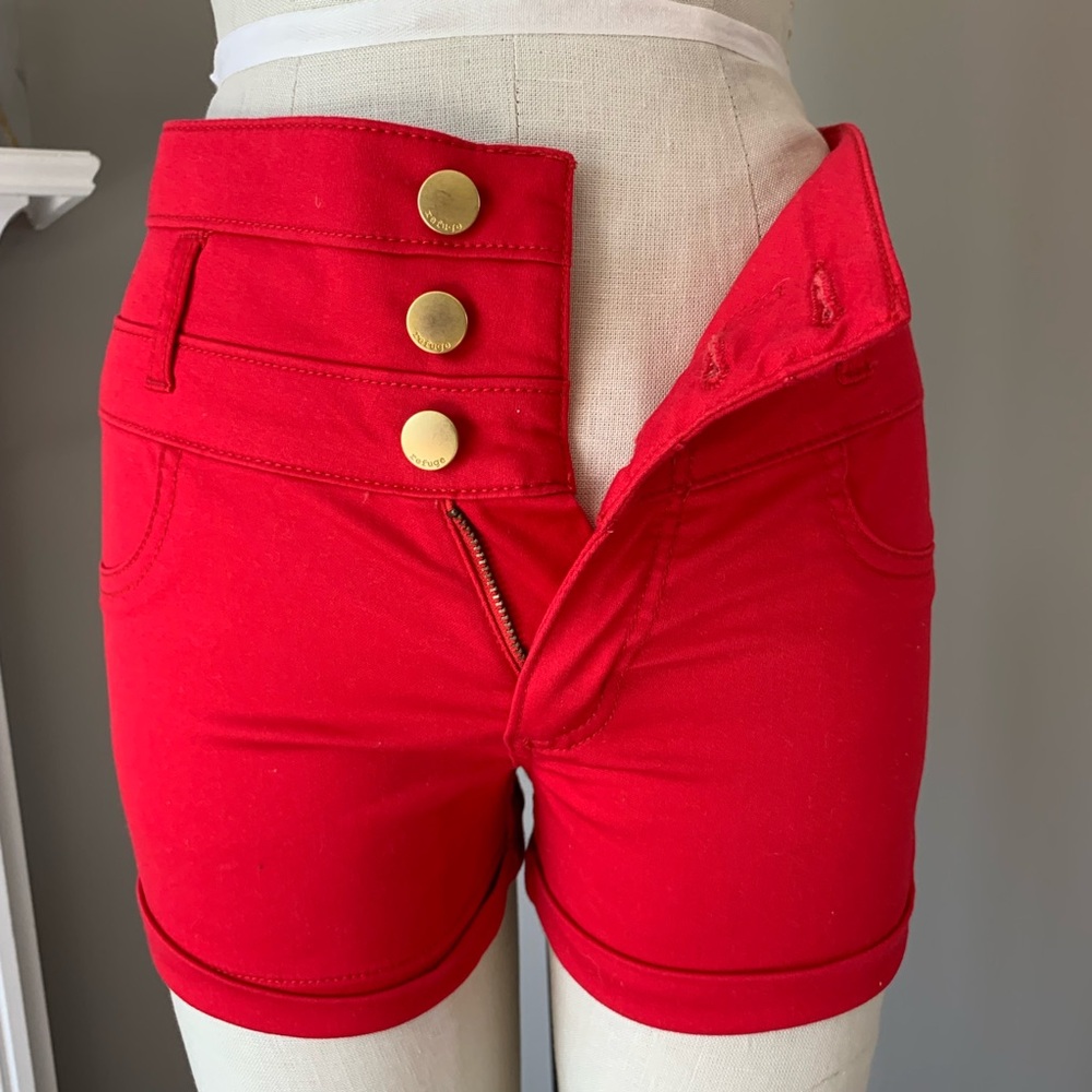2 pairs of white and red size 4 refuge shorts